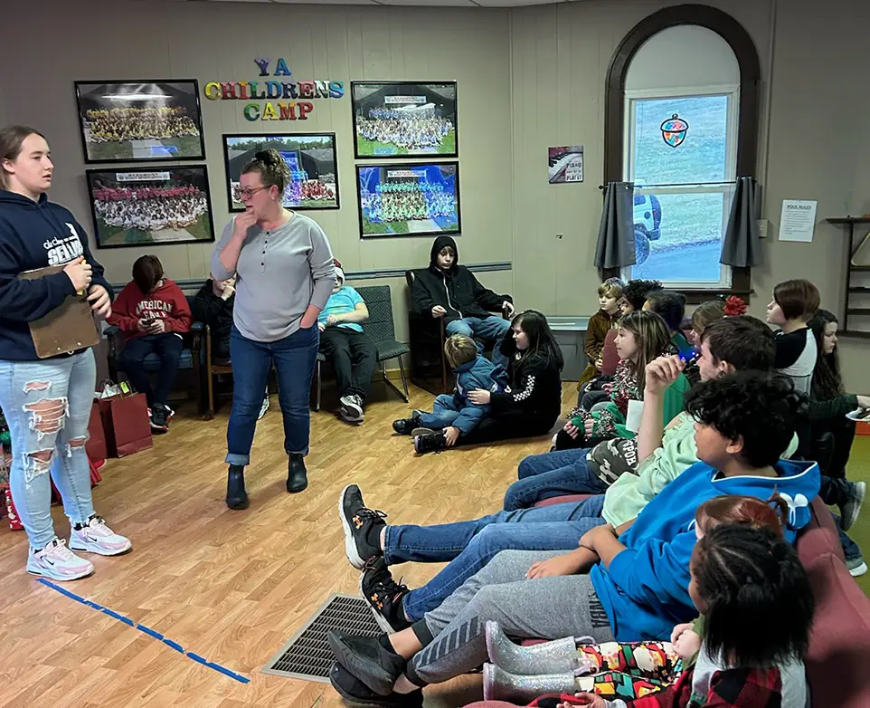 Corinne Carbaugh delivers instructions to kids during a learning instruction at YA