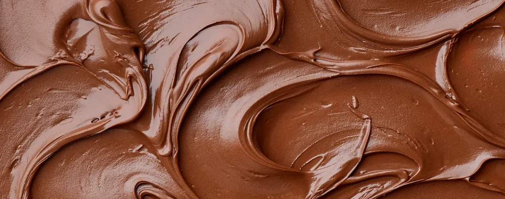 Close up of melted milk chocolate swirls